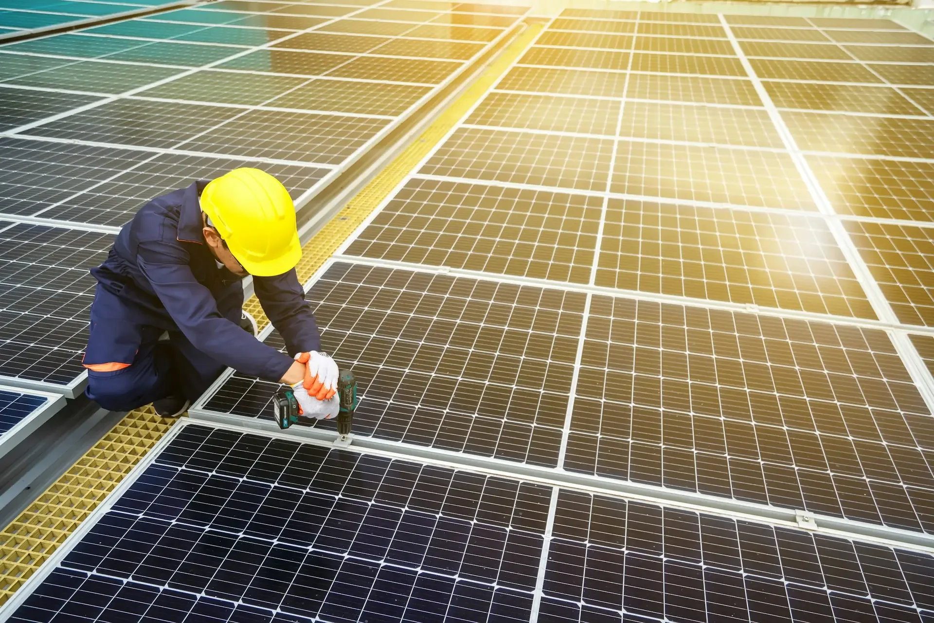 Technician installing high-efficiency solar panels